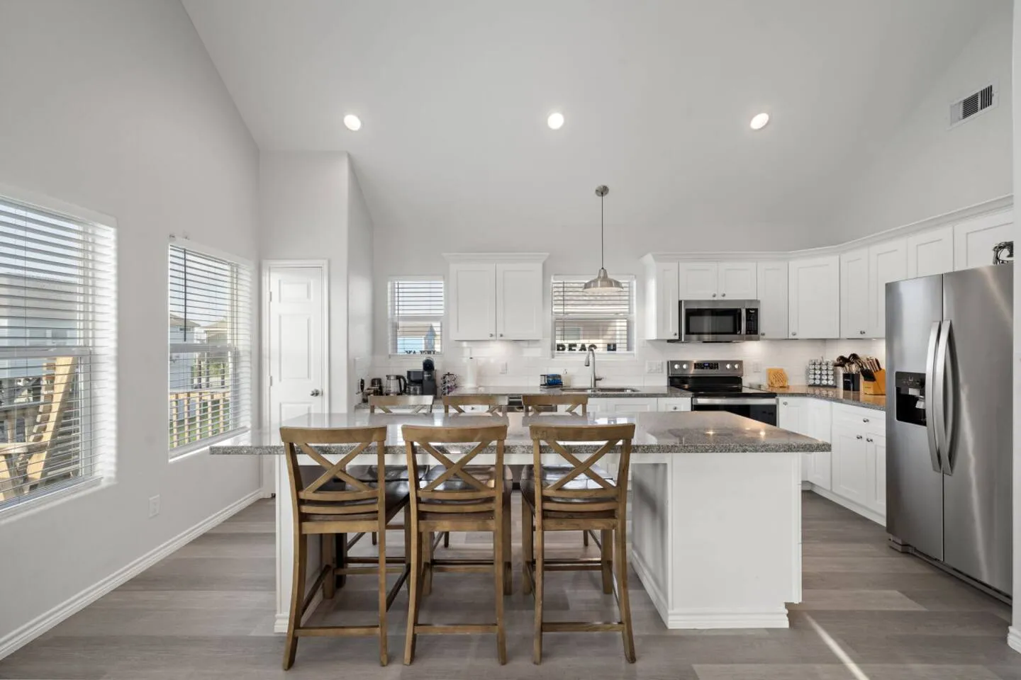 Kitchen and dining space set up for easy meals between beach runs and games.
