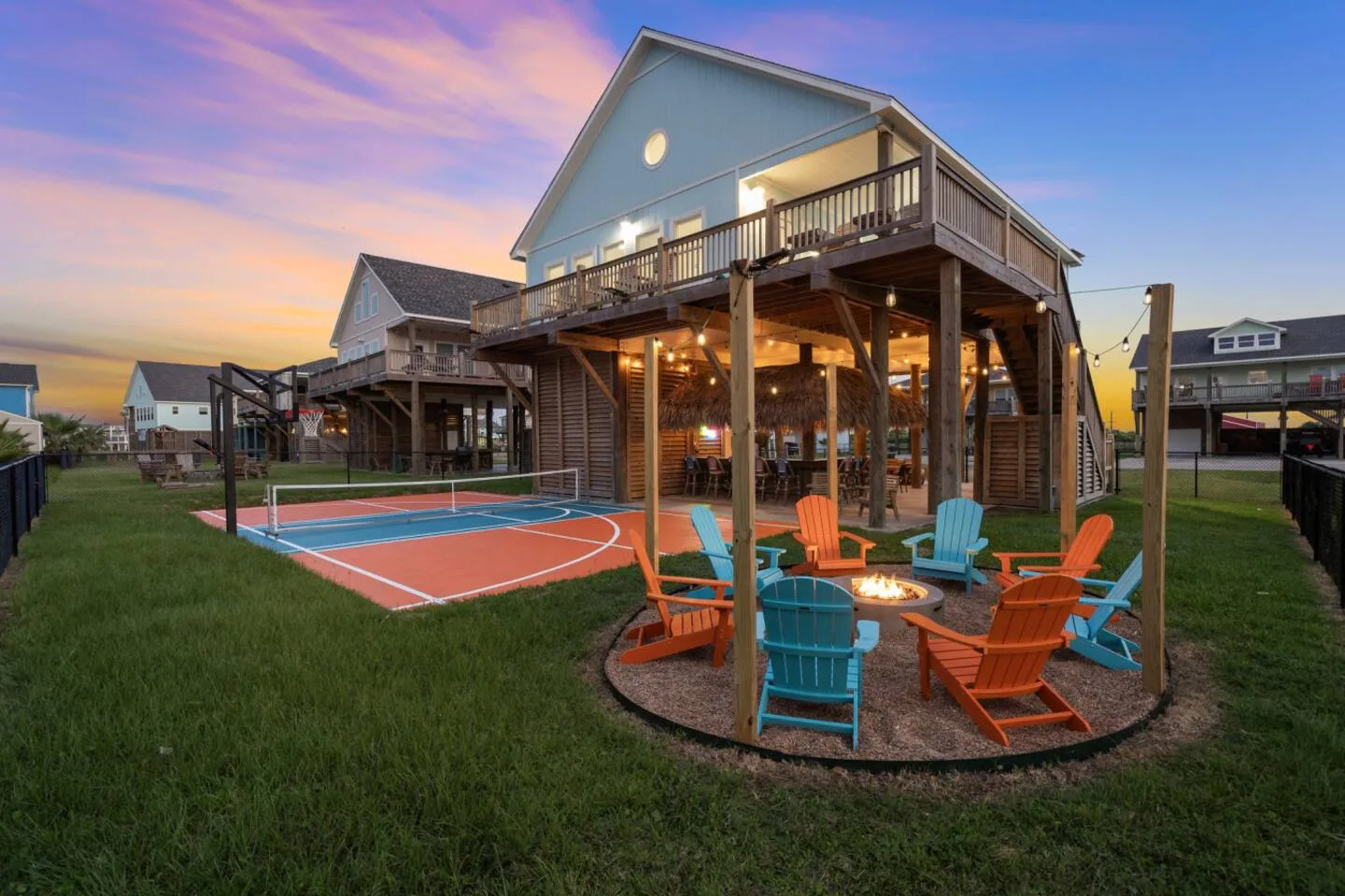 Pickle Beach backyard: private pickleball court, tiki lounge and fire pit