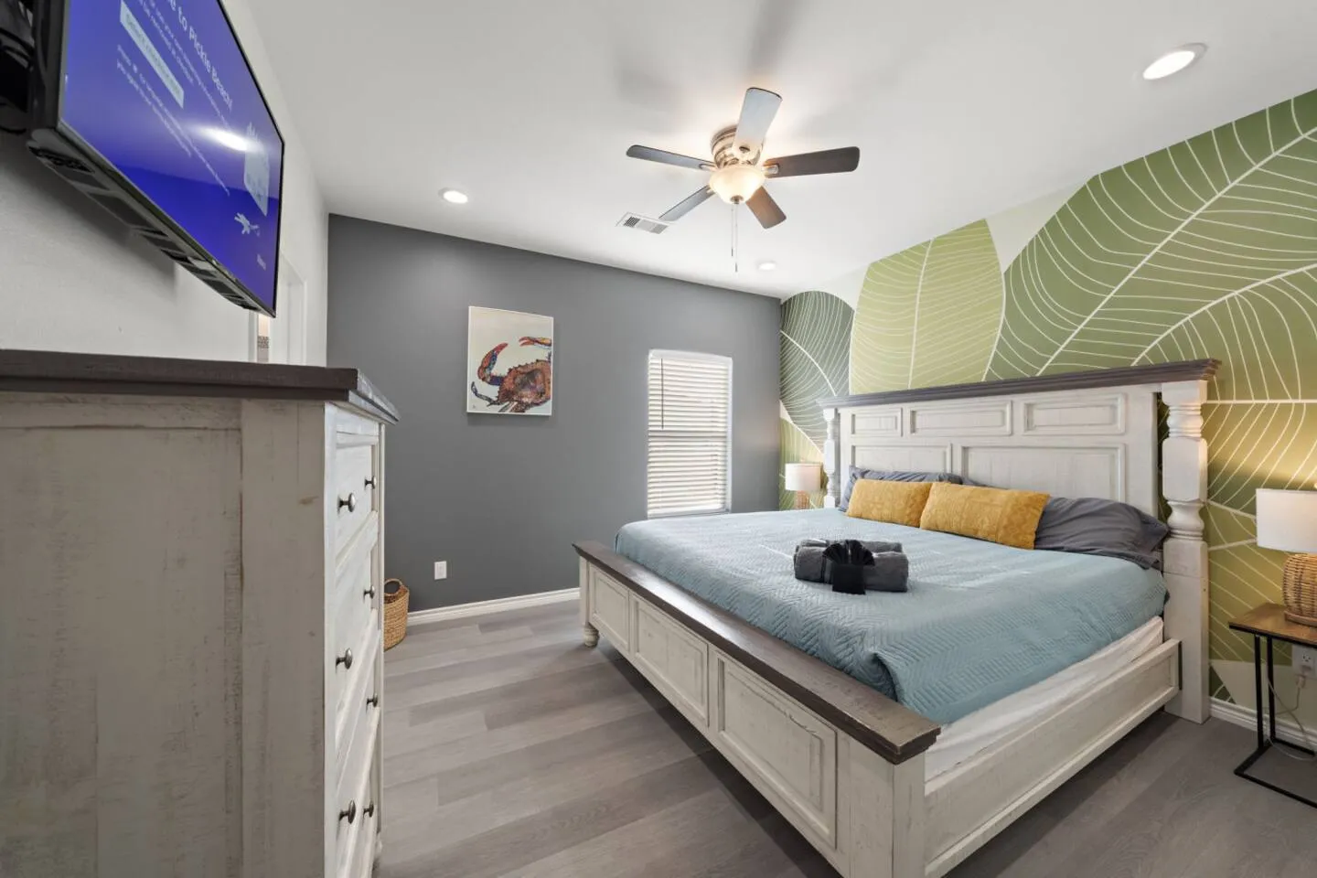 Additional view of Bedroom 1 with king bed and TV.