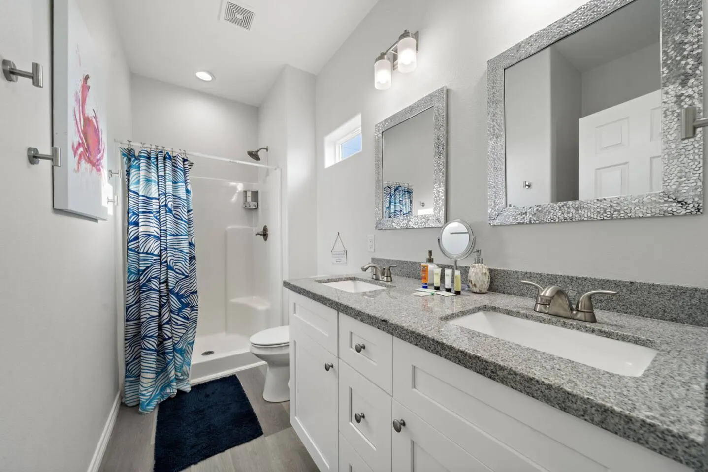 Full bathroom with shower/tub setup and vanity space.