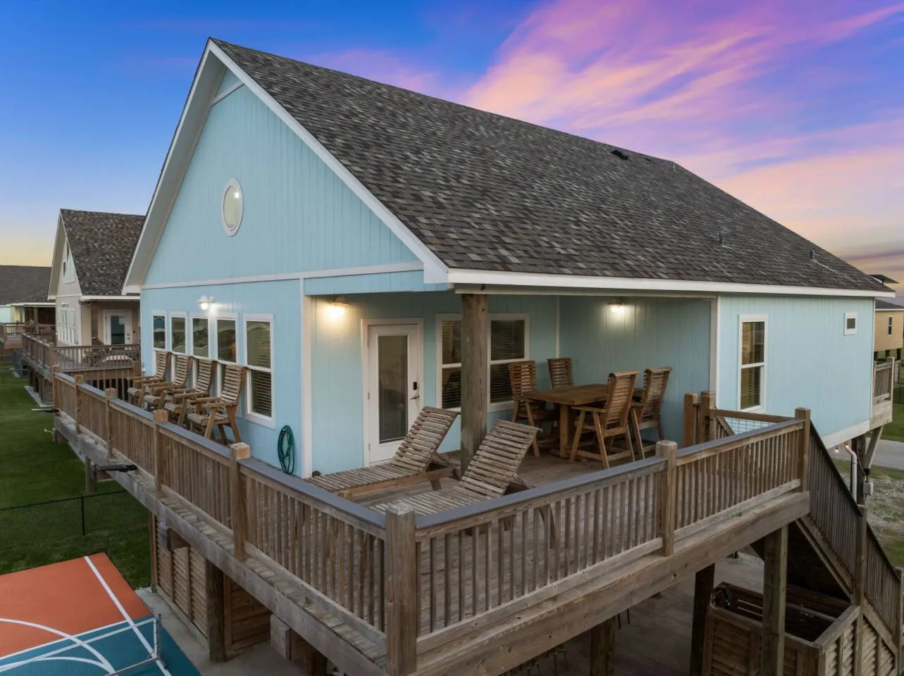 Exterior deck view with outdoor seating and beach-house style.