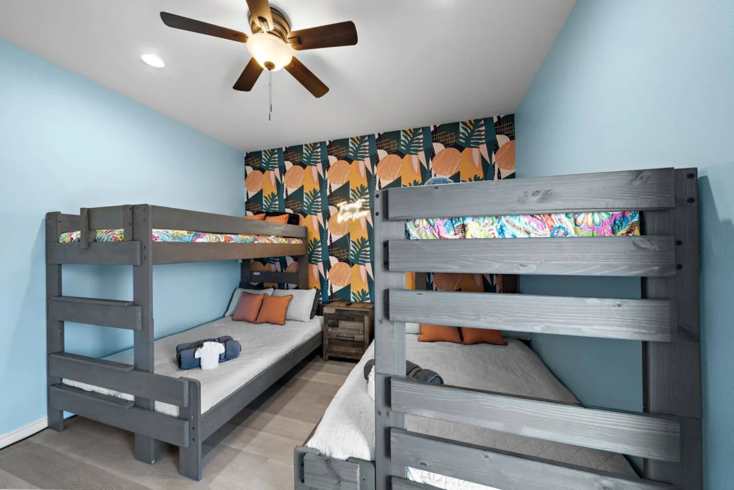 Bunk room with two twin-over-full bunks for flexible sleeping.