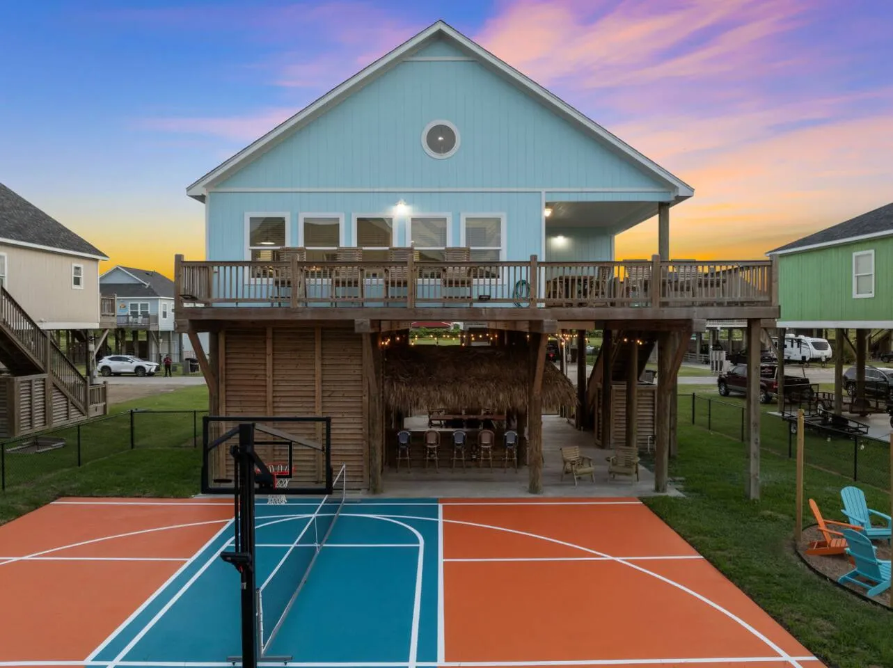 Private court beside the beach house with covered outdoor space.