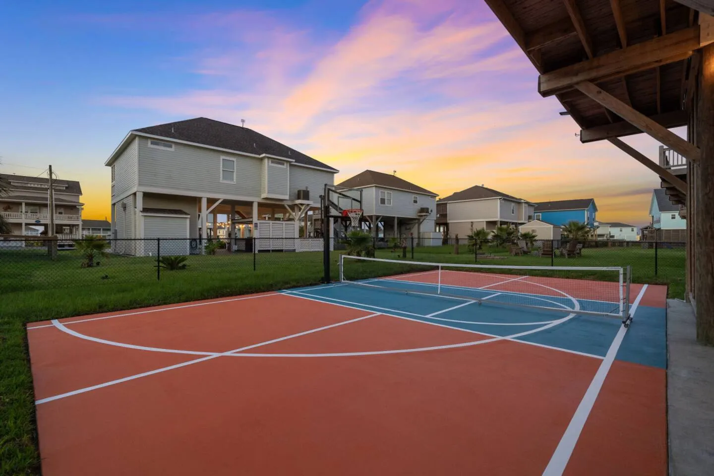 Private pickleball and basketball court with room to play.