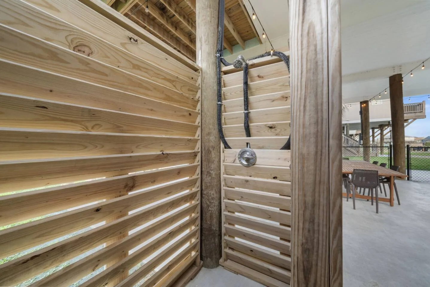 Outdoor rinse area for sandy beach days.