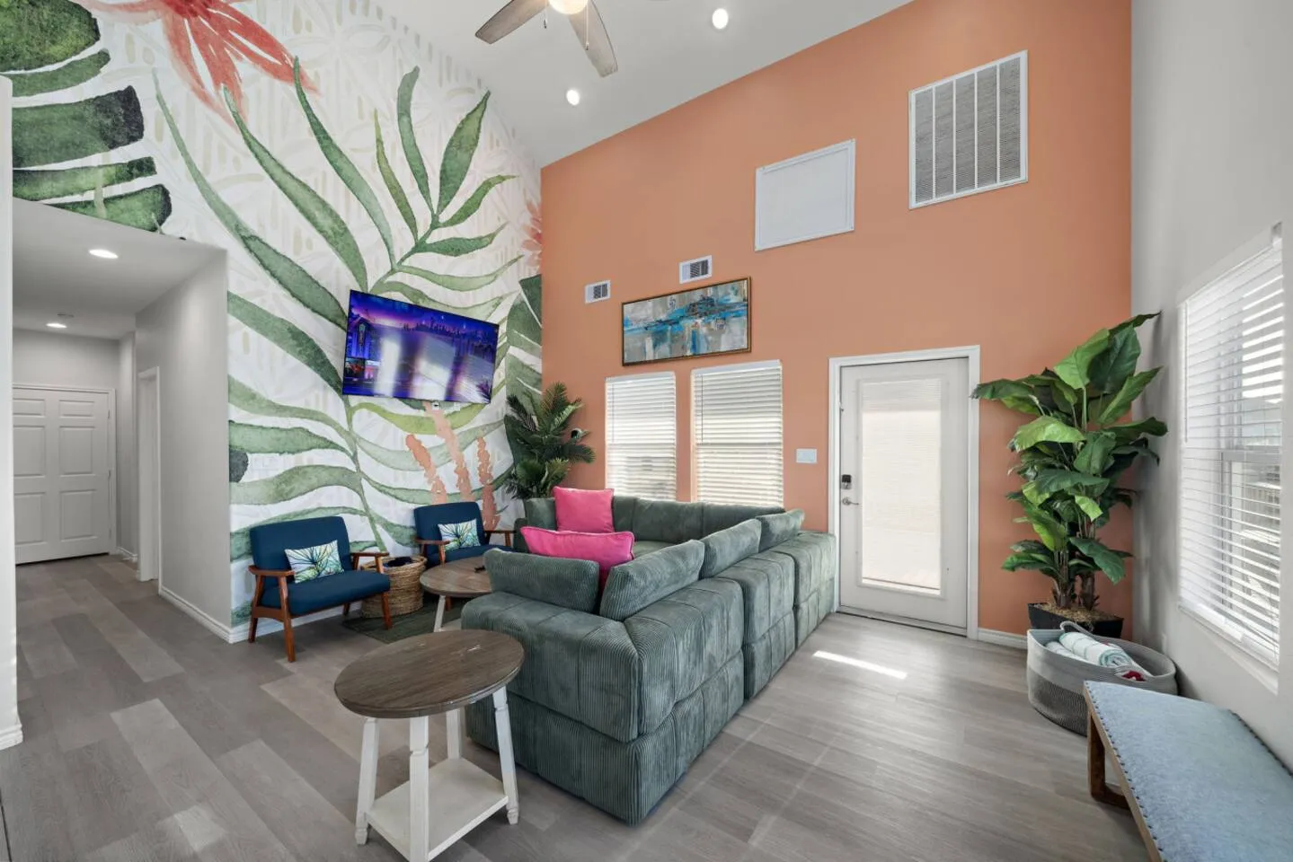 Additional living room view with seating and TV.