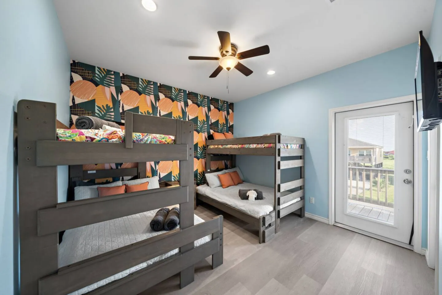 Bedroom 3: two twin-over-full bunks with room for kids or teens.