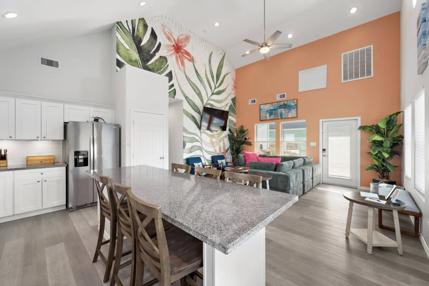 Open kitchen, dining, and living space for group meals and movie nights.