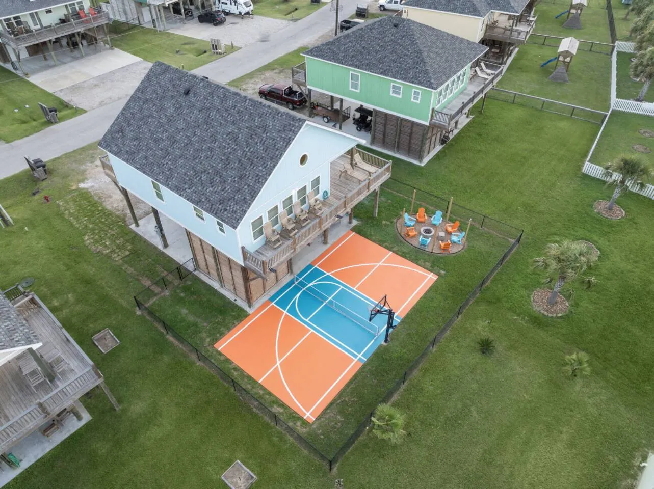 Aerial view of Pickle Beach, the private court, and the beach-house layout.